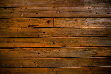 The wall of wooden planks. Wooden background. The texture of the board. Wood texture