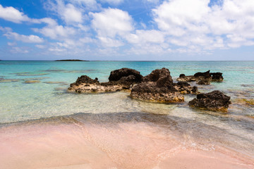 Rocks on Elafonisi beach with pink sand and crystal clear water. Crete Island, Greece