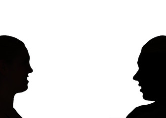 A silhouette of a  man and woman couple looking at each other in love in black and white