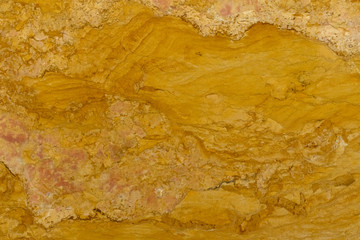 The finishing stone. The polished golden yellow marble. Texture.