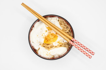 bowl of noodles and chopsticks