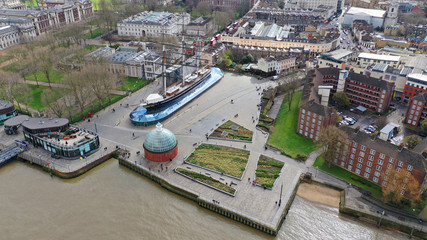 Obraz premium Aerial drone photo of famous Cutty Sark the only tea clipper survived and used as a museum next to Greenwich pier, London, United Kingdom