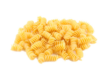 Uncooked spirelli isolated on a white background.