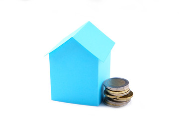 Blue paper house with coins isolated on white background