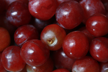 Fresh tropical fruits Red grapes in natural sunlight. 