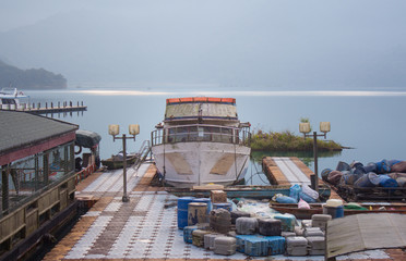 boat and speed boat dock yard in sunrise morning at Sun moon lake , taiwan - 259909336