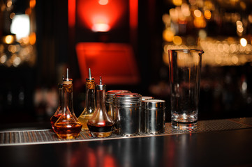 Bartender equipment such as bottles, measuring glass cup and spice shakers