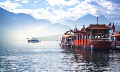 boat and speed boat pier in sunrise morning at Sun moon lake , taiwan - 259910185
