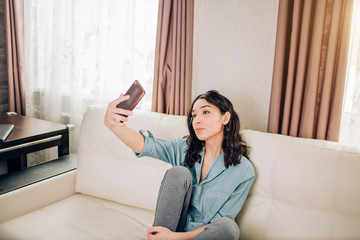 Young woman using smartphone at home