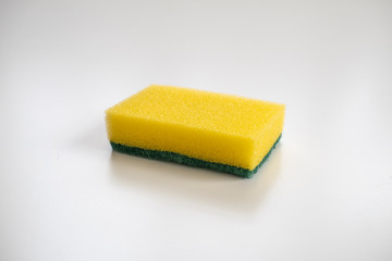 Isolated yellow sponge on the white background