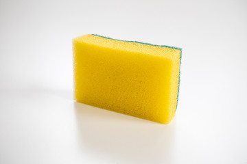 Isolated yellow sponge on the white background