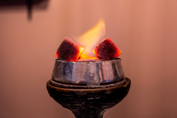 Burning coals on the hookah bowl