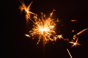 Obraz premium Sparkler background. Christmas and new year sparkler holiday background.