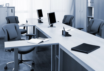 monitors on the desks in modern office