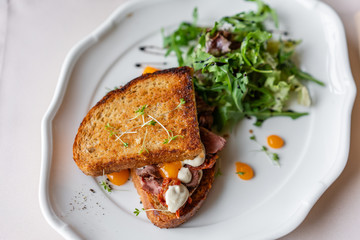 French toast brioche, Sandwich with pastrami and sun-dried tomatoes. Light morning Breakfast, fresh...