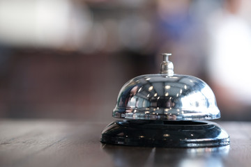 Hotel reception counter desk with service bell.