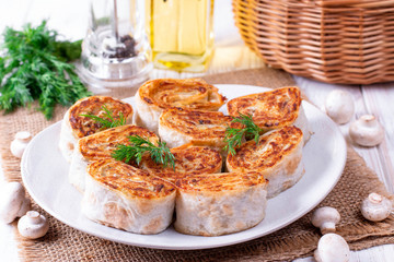 Fried lavash rolls with potatoes and mushrooms
