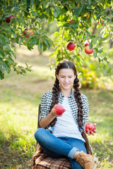 Girl with Apple in the Apple Orchard