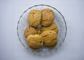 Sweet cookies isolated on white background. Homemade cookies or biscuits or shortcakes in a plate. Beautiful pastry snacks of Turkish culture. Enjoy concept photo. A plate with handmade snacks. 