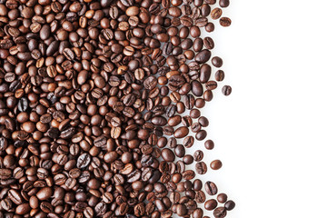 Roasted coffee beans on white background with copy space