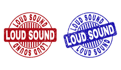 Grunge LOUD SOUND round stamp seals isolated on a white background. Round seals with distress texture in red and blue colors.