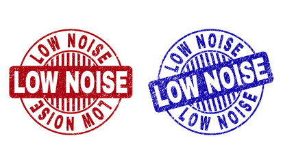Grunge LOW NOISE round stamp seals isolated on a white background. Round seals with grunge texture in red and blue colors. Vector rubber watermark of LOW NOISE label inside circle form with stripes.
