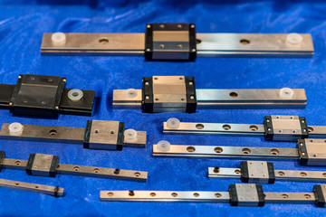 Close up many size of high quality and precision linear ball bearing guide of machine for industrial work on table