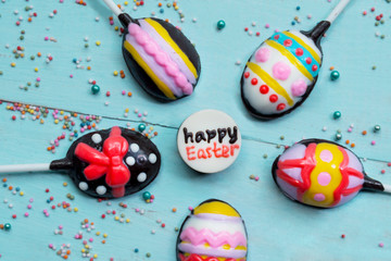 Colorful chocolate candies with happy Easter text