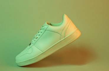 Fashionable white sneakers, retro futurism neon light, minimalism