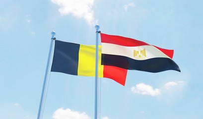 Egypt and Belgium, two flags waving against blue sky. 3d image