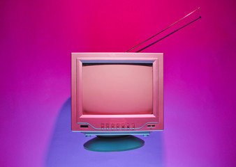 Retro wave, 80s concept. Old tv with antenna, neon light. Night television. Top view, flat lay