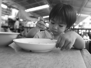 The boys eat the food by himself.