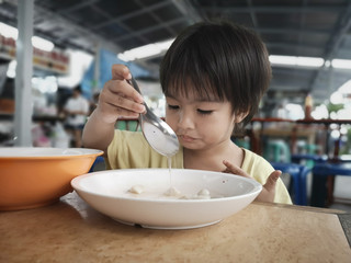 The boys eat the food by himself.