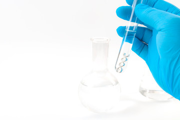 DNA testing, lab experiment and genetic research concept theme with a scientist holding a double helix molecule in a test tube with blue latex gloves isolated on white background with copy space