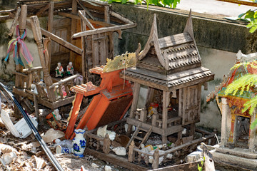 A old damaged religious houses of ghosts. Traditional equipment of Buddhism and Animism in Thailand.