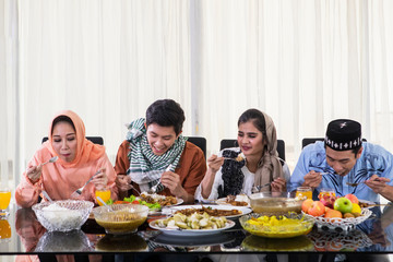 Young people eat during Eid Mubarak celebration