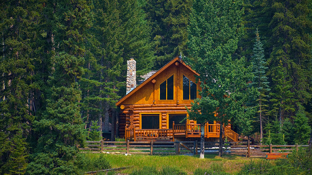 Wooden house commonly found near lakes and rivers. Rocky mountain ( Canadian Rockies ). Portrait, fine art. Near the city of Calgary. Jasper and Banff National Park, Alberta, Canada: August 2, 2018
