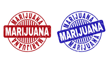 Grunge MARIJUANA round stamp seals isolated on a white background. Round seals with grunge texture in red and blue colors. Vector rubber watermark of MARIJUANA label inside circle form with stripes.