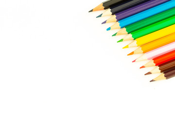colored pencils on a white background / empty space for text