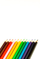 colored pencils on a white background / empty space for text