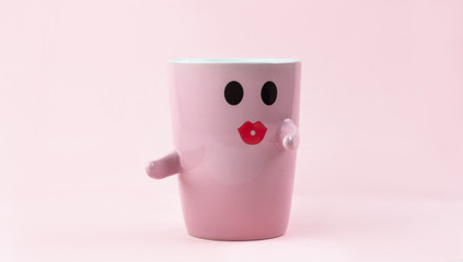 Happy friday word. Cup of coffee on pink background with smile face on mug. Concept about love and relationship. Creative colorful greeting card