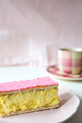 traditional Dutch sweet pastry tompouce, waffle with pudding and pink frosting, Cup of coffee,...