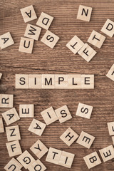 the word simple written with wooden letters