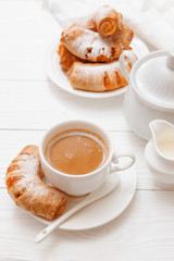Coffee, orange jam bagels. Breakfast. on wooden table. 