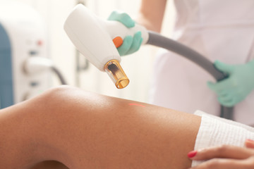 Close up of the laser tool on the leg of patient