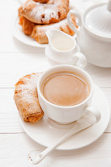 Coffee, orange jam bagels. Breakfast. on wooden table. 