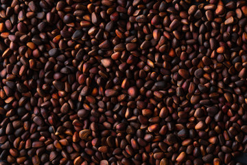 Pine nuts on stone table background. Top view with copy space