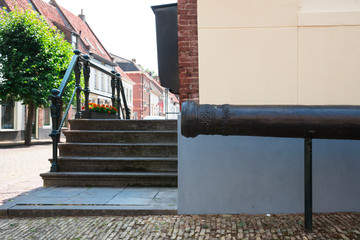 cannon and stairs in street Buren, The Netherlands