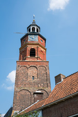Fototapeta na wymiar tower of Sint-Lambertuskerk, Buren, The Netherlands, against blue sky, space for text
