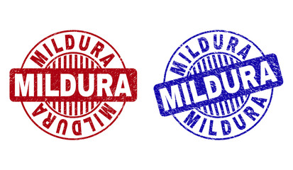 Grunge MILDURA round stamp seals isolated on a white background. Round seals with grunge texture in red and blue colors. Vector rubber overlay of MILDURA tag inside circle form with stripes.